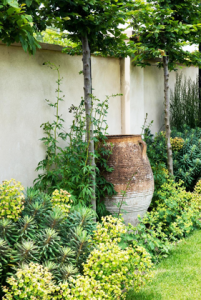 Swimming pool courtyard with large pot