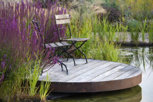 chair sitting in front of a wildlife garden